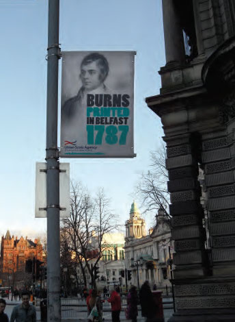 A Robert Burns commemorative street banner in Belfast city centre outside the former Scottish Provident Building beside City Hall
