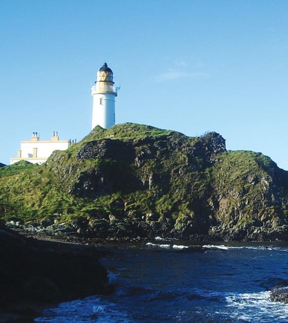 The remains of Turnberry Castle, under the lighthouse, on the Ayrshire coast within the district of Carrick. County Antrim is just across the North Channel